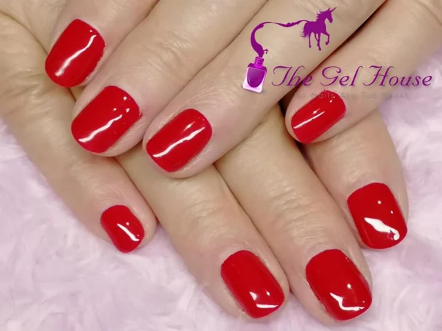 A classic glossy red gel manicure by Tammy