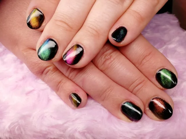 Dark gel nails with colourful shimmering accents by Tammy